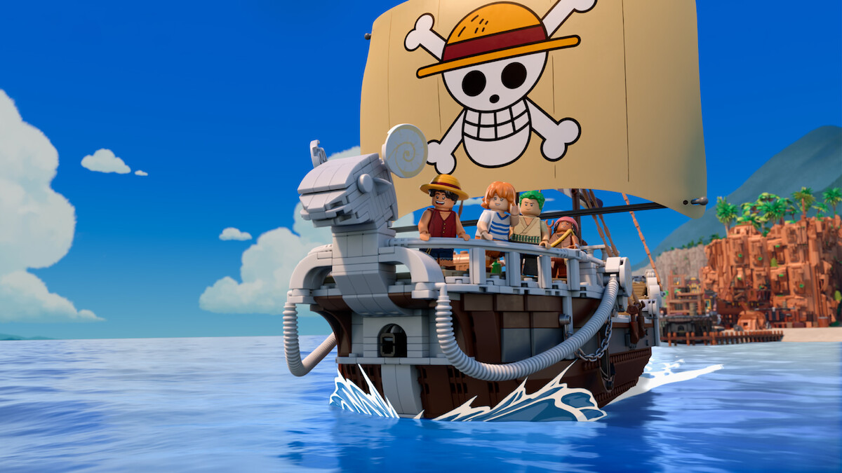 Luffy, Nami, Zoro e Usopp em versões LEGO a bordo do Going Merry, com a bandeira dos Chapéus de Palha